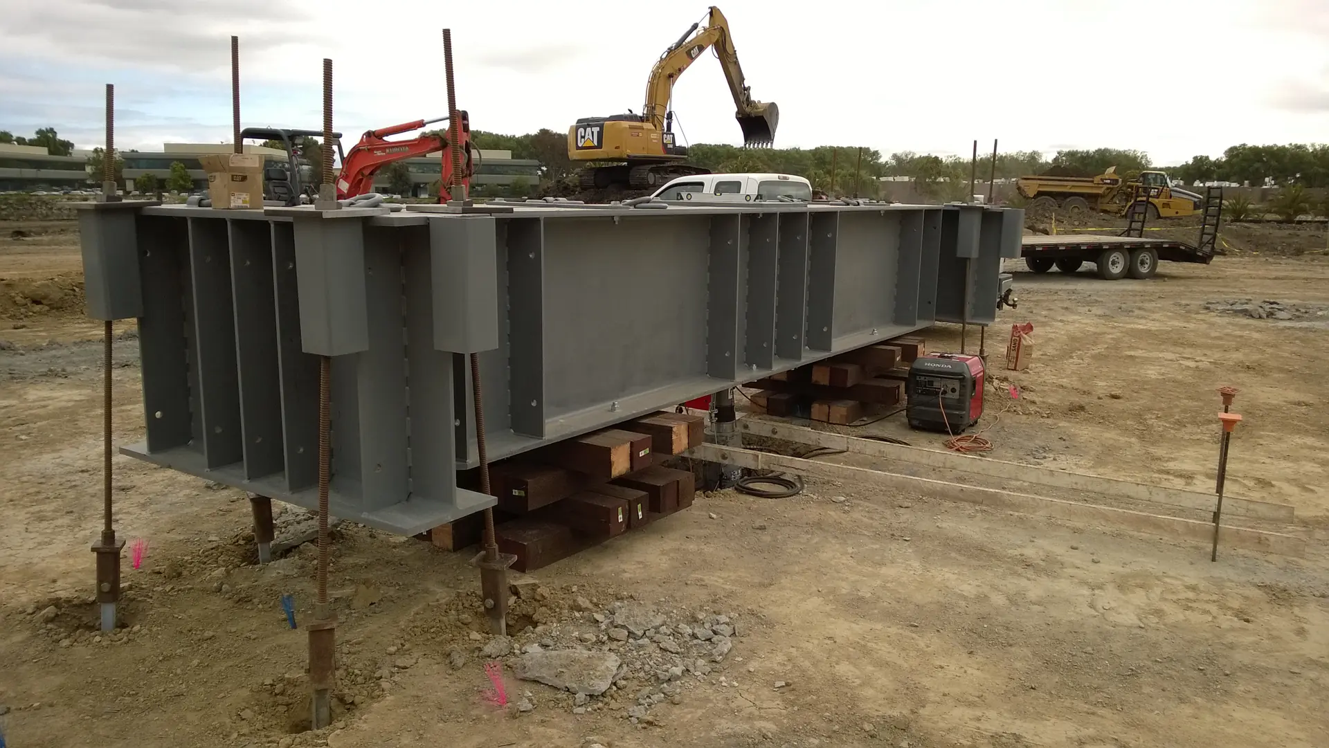 Reaction beam set on cribbing for a load test.